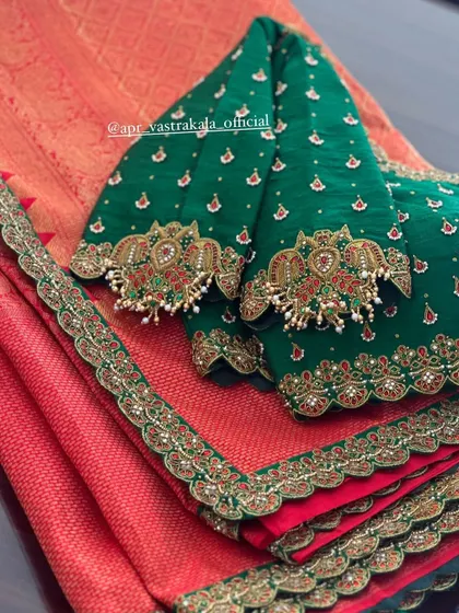 A close-up of the sleeves on the green and pink blouse.
