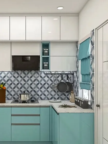 A vibrant modular kitchen design featuring a playful combination of turquoise and white cabinets. The patterned tile backsplash adds a pop of personality, while the layout remains practical for daily use.