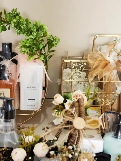 The details matter. This shot highlights the mix of textures and products in our Kimirica display, from the wicker basket to the gold palm leaf accent.