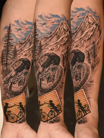 A story of father and son, told through realism. This forearm piece captures the dynamic action of mountain biking, complete with realistic terrain and a touching silhouette of their bond.