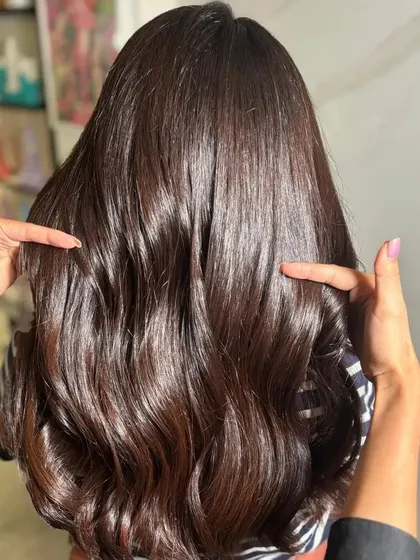 The best accessory is a fresh hair color. This client is glowing with her new rich, dark color.