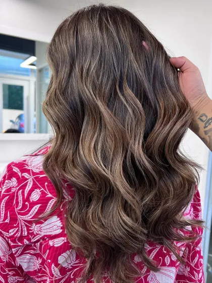 My signature balayage technique creates these beautiful, flowing ribbons of color, adding dimension and life to the hair.