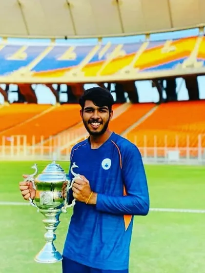 Mayank Shandilya, our academy player and Haryana Under-19 skipper, holding a trophy at a major stadium. His all-round performance of scoring runs and taking wickets is a great example for others.