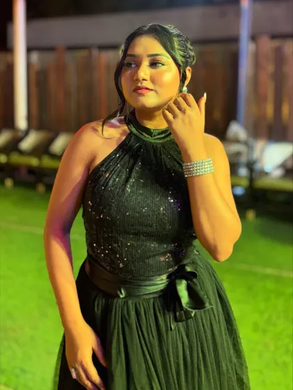 The black gown in an outdoor setting. It's versatile enough for both indoor ballrooms and outdoor evening events.