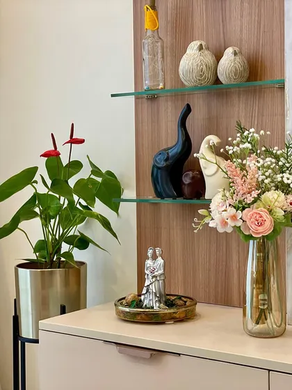 Fresh flowers and curated decor pieces on the console add life and elegance. I believe these finishing touches are essential for making a space feel complete and personalized.