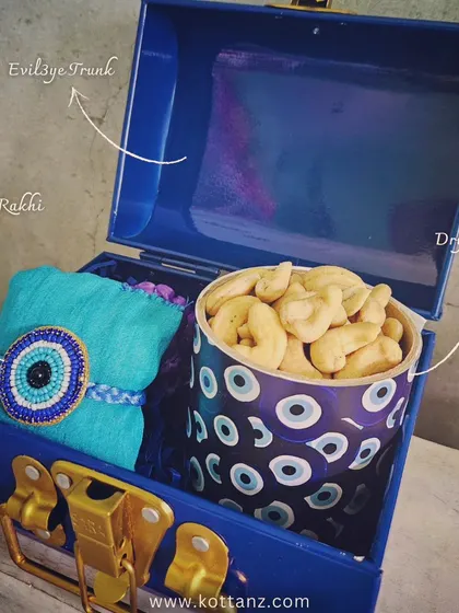 Our Raksha Bandhan hampers include this evil eye themed trunk box, complete with an evil eye rakhi and dry fruits to keep your siblings safe.