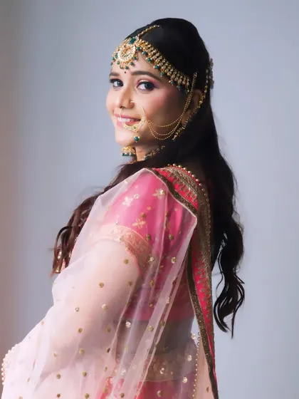 This side profile of a bride shows the soft glam makeup and elegant hairstyle that is perfect for modern wedding ceremonies.