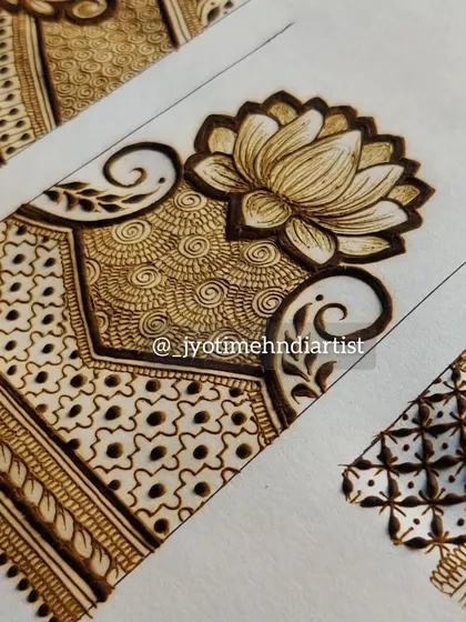 A close-up of the lotus startup pattern, showing the delicate shading and spiral fills.