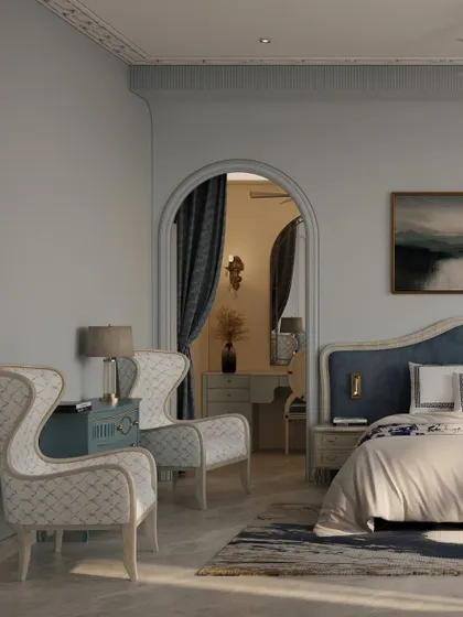 An archway provides a graceful transition from the bedroom into the dressing area, creating a sense of a private, luxurious suite. The wingback chairs add a touch of classic elegance.