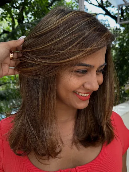 The smile says it all. A great hairstyle is an instant confidence booster.