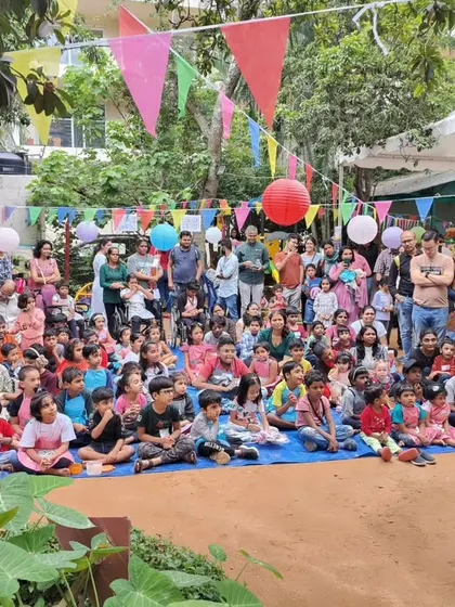 A wide shot of my performance at a vibrant outdoor carnival. My act stands out and draws a crowd, making it a great addition to any festival or fair.