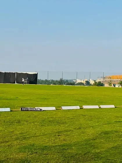 The ground is always maintained in match-ready condition. This photo shows the clear boundary lines, the sight screen, and the well-kept pitch, ready for the day's play.