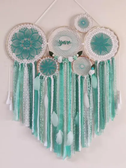 Another look at our minty fresh cluster dreamcatcher, personalized for 'Yusra'. The combination of different textures and shades of green creates a soothing and serene atmosphere.