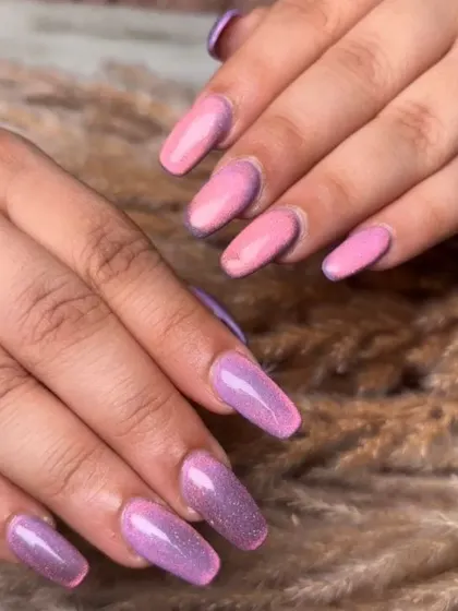 A vibrant pink and purple glitter ombre set. This look is fun, sparkly, and perfect for anyone who loves a bold and colorful manicure.
