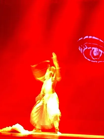 A powerful moment from the finale, paying obeisance to Devi during Navaratri. The choreography incorporated the fiery energy of traditional Durga Puja dances, set against a backdrop of striking visual projections.