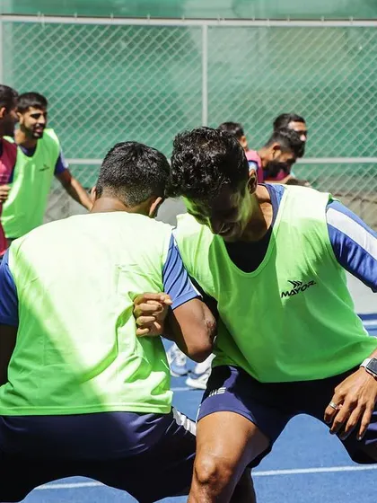 We are proud to be a close partner to Sporting Club Bengaluru on their incredible journey to the I-League. This image captures a moment of intense focus during a team warm-up, showcasing the dedication that has fueled their historic promotion.