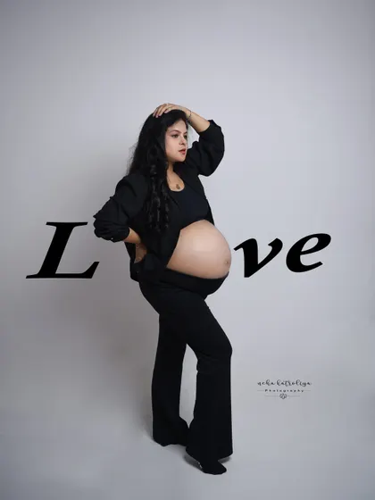 A powerful stance with the word "Love" overlaid. This image is a bold declaration of the love and strength that defines motherhood.