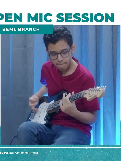 A student showcasing his electric guitar skills at the BEML branch open mic. My school offers a platform for instrumentalists as well as vocalists.