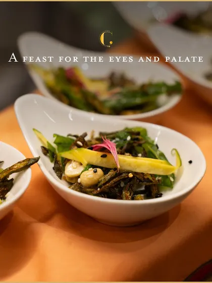 A closer look at our crispy okra and raw mango salad. It's a feast for the eyes and palate, showcasing our ability to create innovative vegetarian dishes.