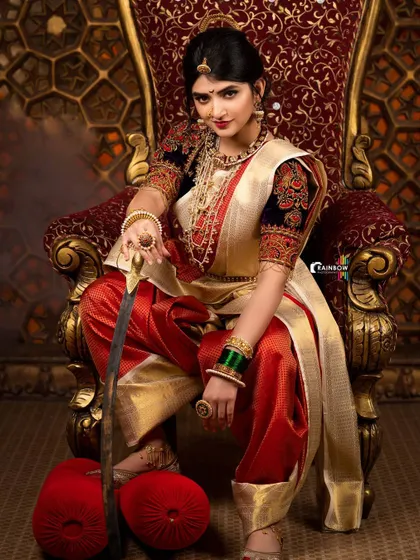 A close-up variation of the Sreeleela warrior concept, focusing on her expression and the exquisite details of her makeup and jewelry.