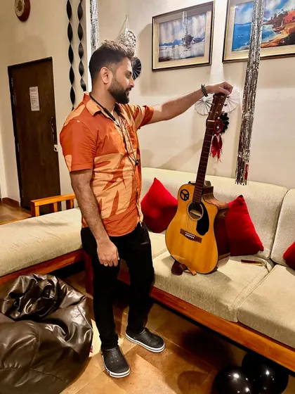 My guitar is my partner in crime. A candid moment showing my appreciation for the instrument that helps me create music.