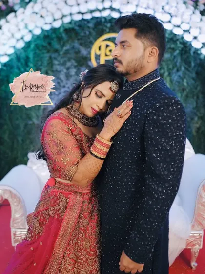 An intimate moment captured beautifully. The bride's reception makeup is soft yet defined, perfect for close-up shots.