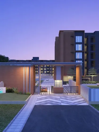 The entrance to Casagrand SouthBrooke at twilight, where architectural lighting highlights the clean lines and modern materials of the gateway.