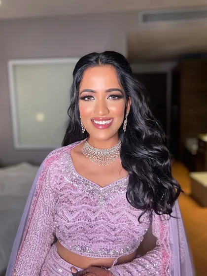 This portrait captures the joy and excitement of the sangeet night. The makeup is glamorous yet feels light and comfortable.