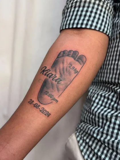 A slightly different angle of the baby footprint tattoo.