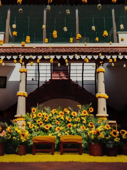 Another perspective of the sunflower-themed Haldi stage, showcasing the beautiful symmetry and rich color palette of the decor.