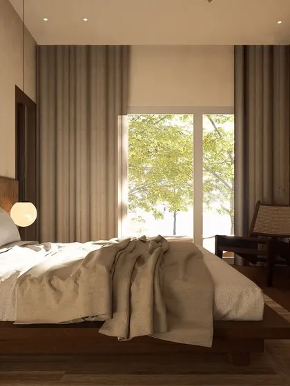 Natural light floods this Japandi-themed bedroom, creating a bright and airy feel. The design uses a simple material palette of wood and linen to evoke a sense of peace and tranquility.