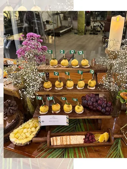 Mini Vada Pavs on a three-tiered stand, decorated with little flags. A fun and patriotic presentation for a special event.
