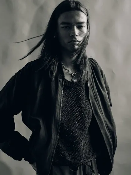 A black and white portrait with a touch of movement in the hair. This adds a raw, untamed feeling to an otherwise controlled studio environment.