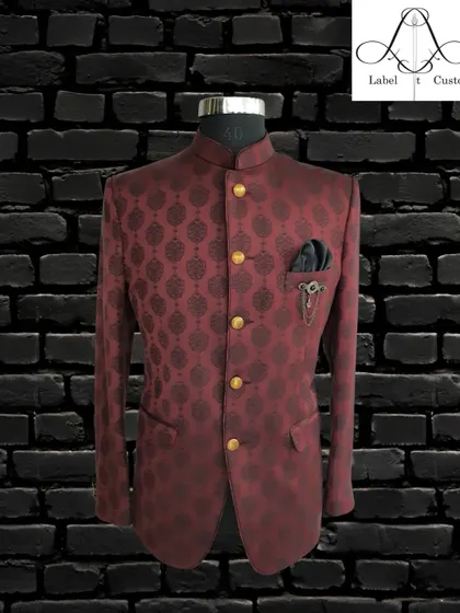 A deep maroon bandhgala with a subtle, dark damask pattern. This piece is all about understated luxury, perfect for a gentleman who appreciates fine tailoring and classic design.