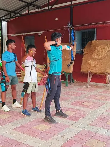 An evening archery training session in progress. Archery teaches focus, discipline, and the power of letting go, skills that are valuable both in sport and in life.