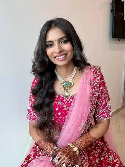 A soft and pretty look for this client in a vibrant pink lehenga. I used subtle smokey eyes and a neutral pink lip to create a balanced and elegant style.