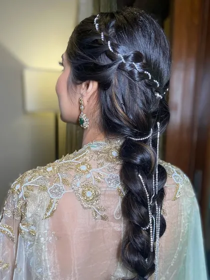 The intricate braiding and sparkling accessories make this a truly standout hairstyle.