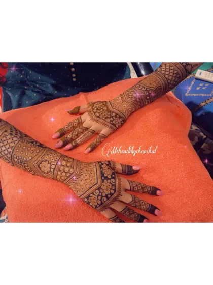Both arms adorned with intricate, matching patterns for an engagement ceremony.