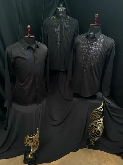A trio of my black designer shirts. Each one features a unique embellishment, from cascading beads to a geometric bib, showcasing different ways I use handwork to elevate a classic black shirt.