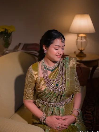 A serene moment of the mom-to-be. Her custom blouse and beautiful saree create a look of timeless elegance for her baby shower.