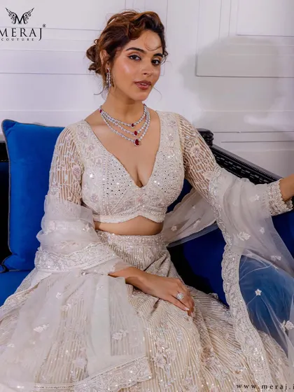 Regal grace meets exquisite craftsmanship in this ivory lehenga from my 'Ruvaah' collection, featuring intricate hand embroidery and delicate sequin embellishments.