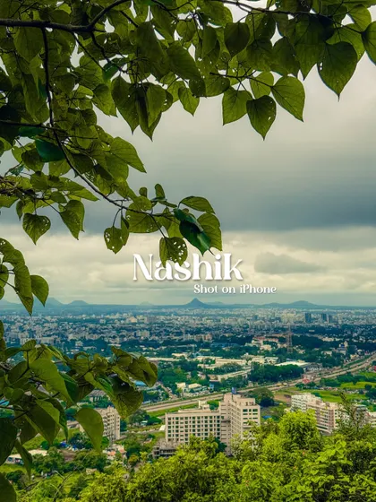 A view of Nashik city, framed by leaves. The text overlay was added to create a simple, elegant postcard from my travels.