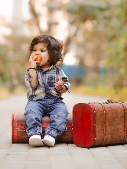 A little traveler taking a break on his vintage suitcases. This themed pre-birthday shoot is full of character and charm.