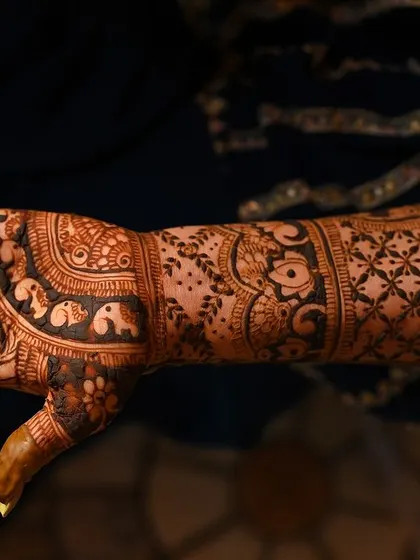 A side view of the arm, showing the flow of the design and the various traditional elements incorporated.