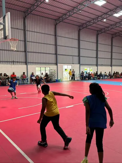Young players competing on our court, with ample space for spectators and teams.