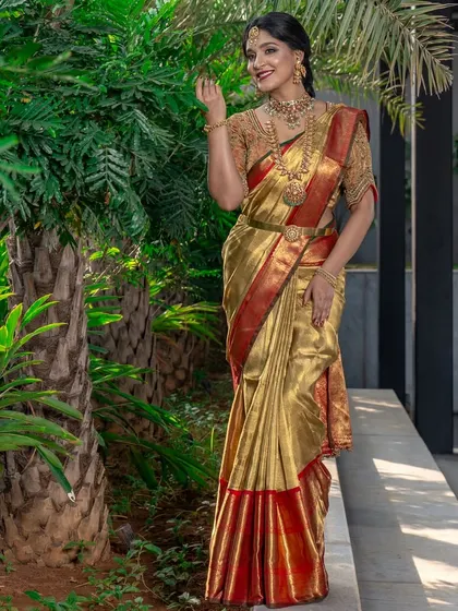 A full-length shot that captures the grandeur of a Kanjeevaram saree. You'll learn how to create makeup that stands up to the richness of such fabrics, ensuring the bride looks balanced and beautiful.