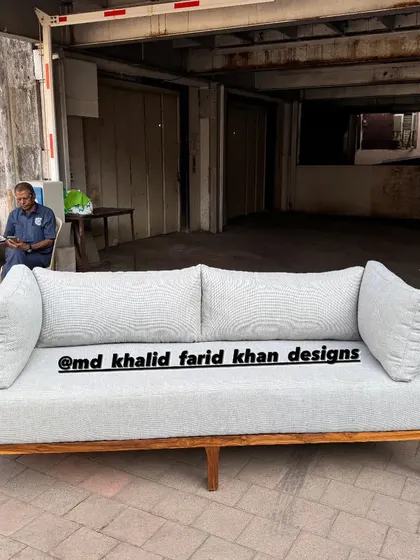The full length of the cane-backed sofa, highlighting its elegant and airy design.