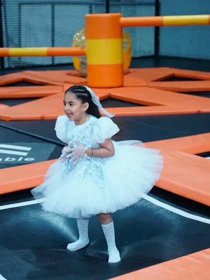 A little princess enjoying a bounce in her beautiful dress during a themed birthday party held in our play zone.
