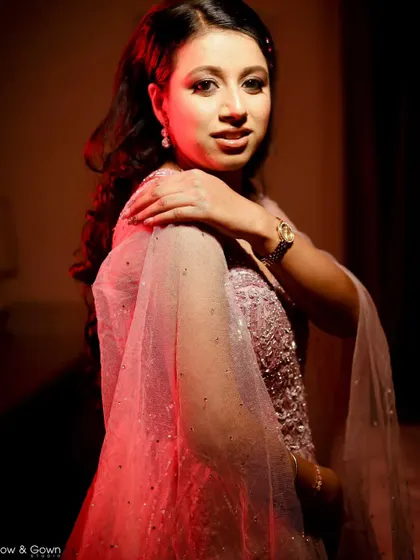 A stunning portrait of the bride-to-be under warm, dramatic lighting. This shot from her engagement day is both glamorous and intimate.