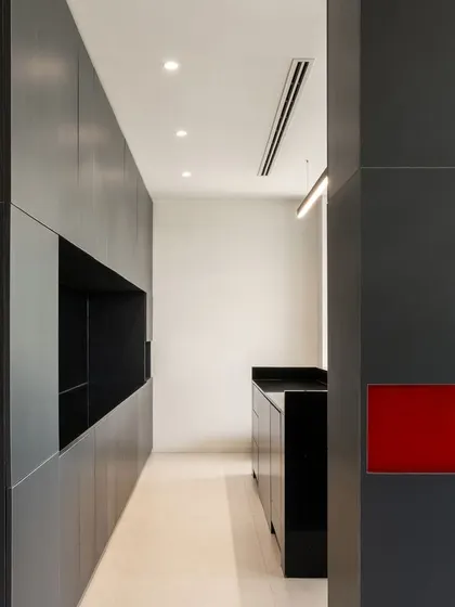 A close-up of the minimalist interior, showing the precise joinery and the unexpected inset of red. This detail reflects our process of simplifying design until only the most honest and essential elements remain.